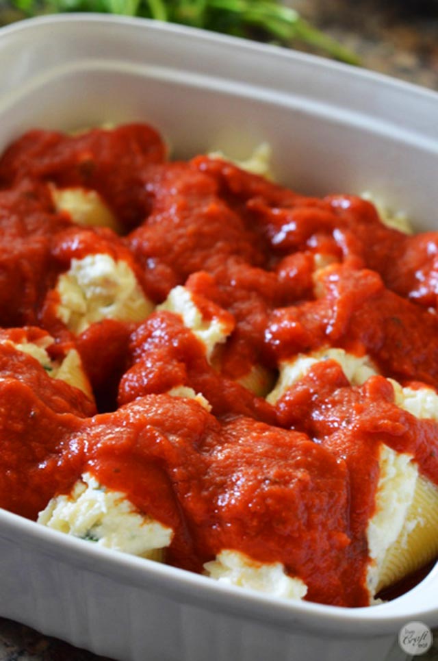 easy three-cheese stuffed pasta shells with marinara sauce.