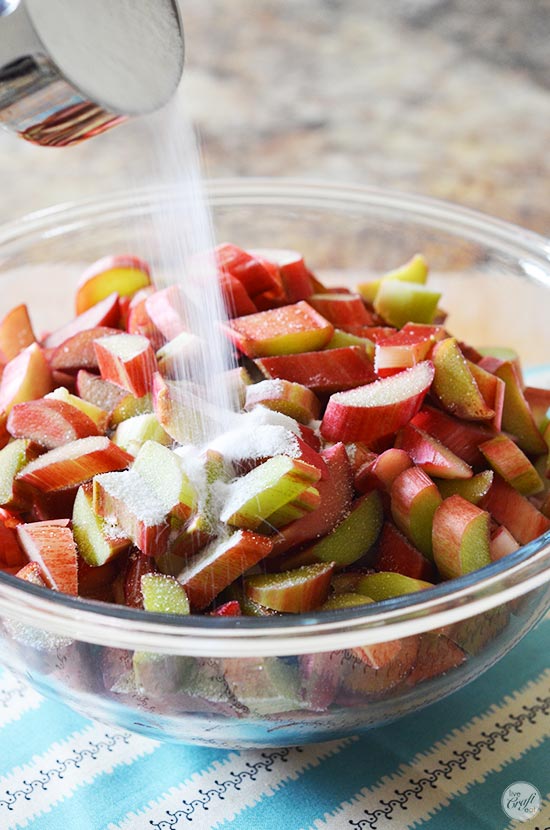 add sugar to rhubarb to give it a sweet & tart flavor.