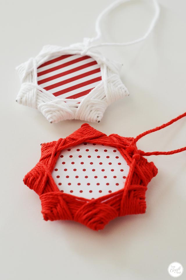 adorable christmas star ornaments made with just yarn & cardboard.