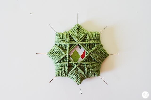 step by step instructions on how to make a woven christmas star ornament