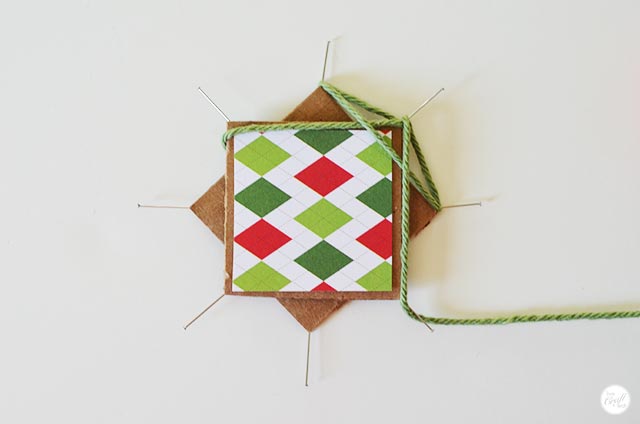 step 5 for how to make a faux-woven christmas star using string/yarn.